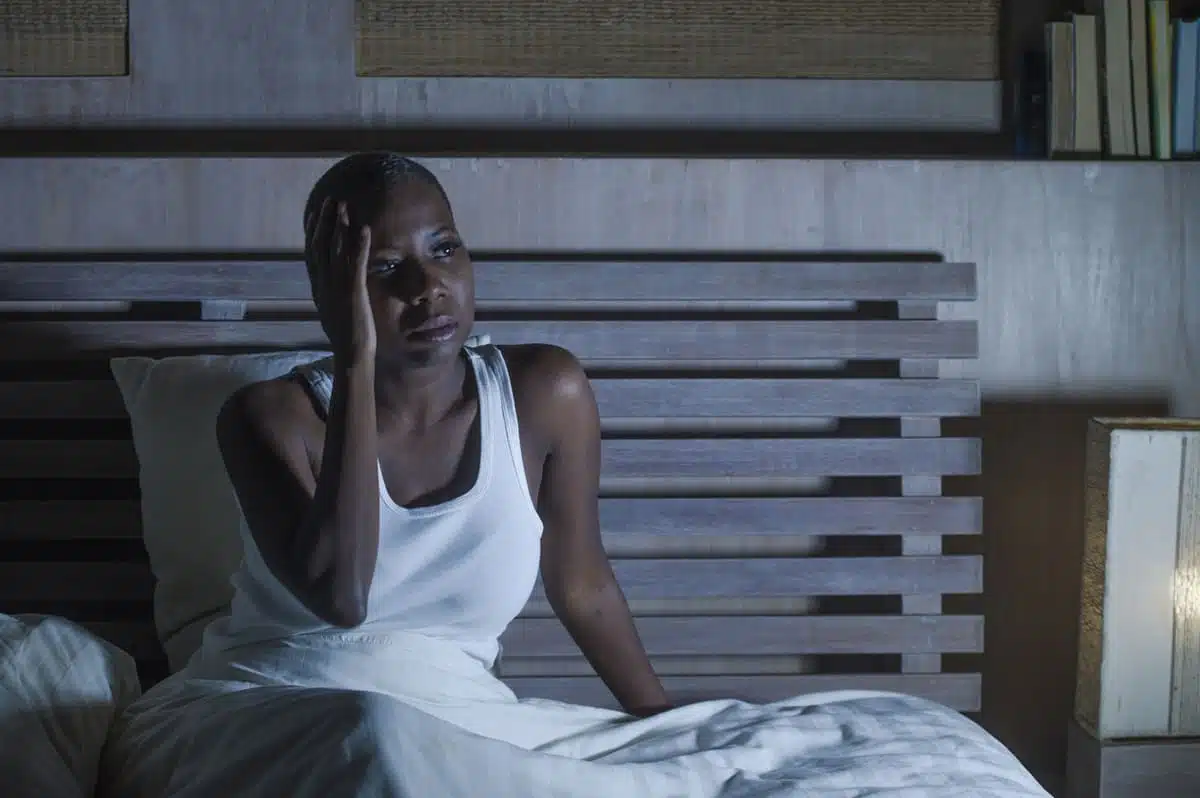 stressed woman unable to sleep or headache