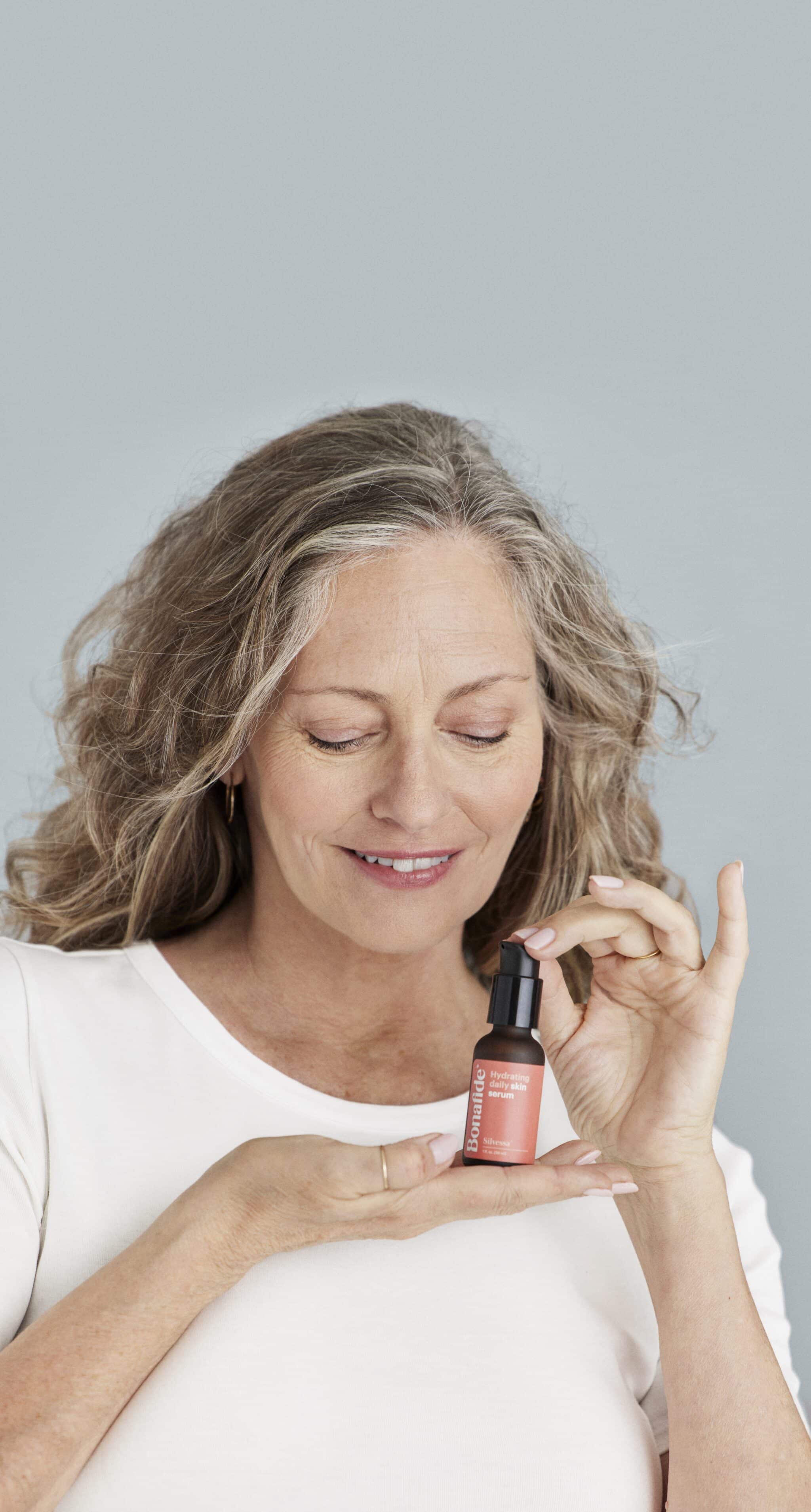 woman holding silvessa bottle