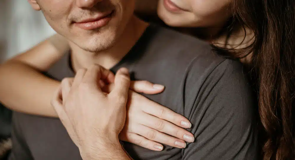 Femme Pharma couple hugging