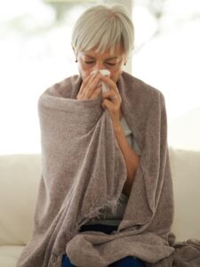 sick woman fighting the flu