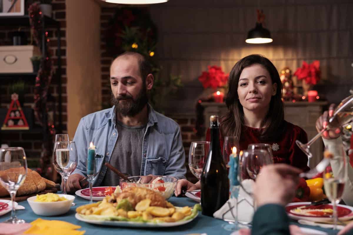 man and woman having a holiday meal together