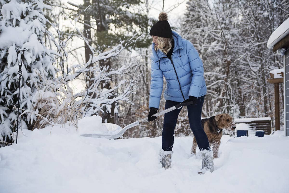 woman shoveling snow