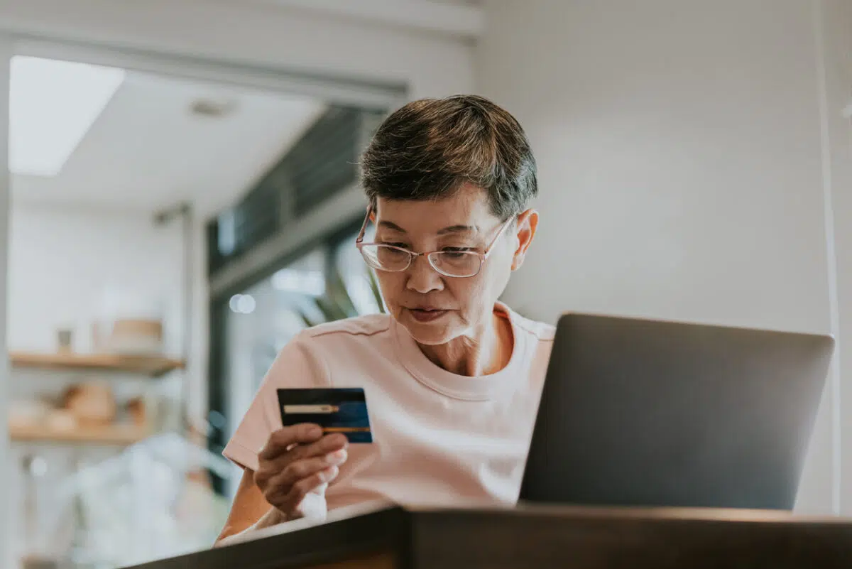 Woman online shopping with a credit card
