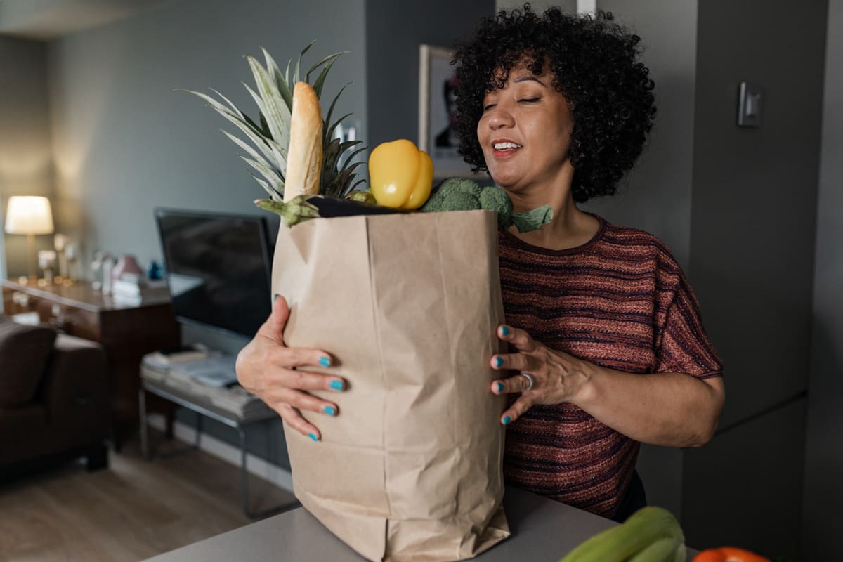 functional fitness woman carrying grocery bags