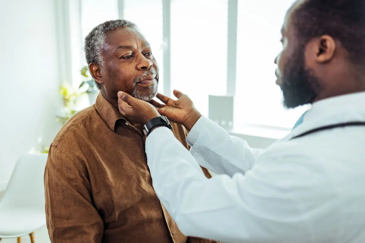 man visiting with his doctor