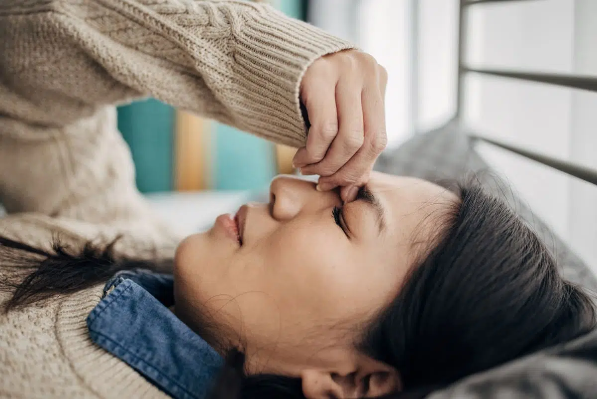 woman with a migraine or headache