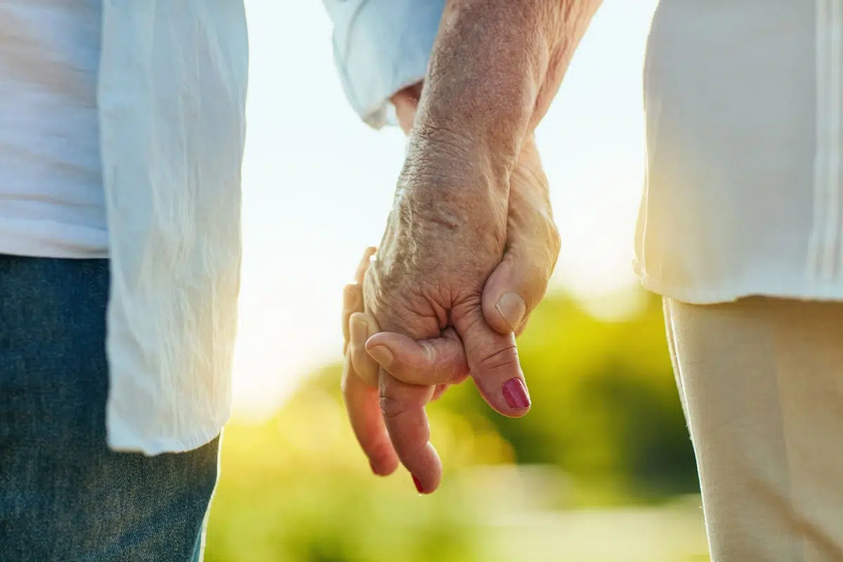 Couple holding hands