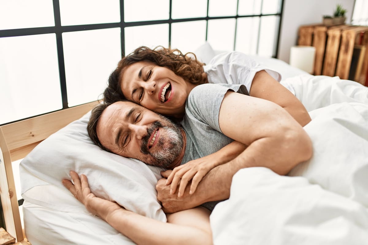 couple happy in bed