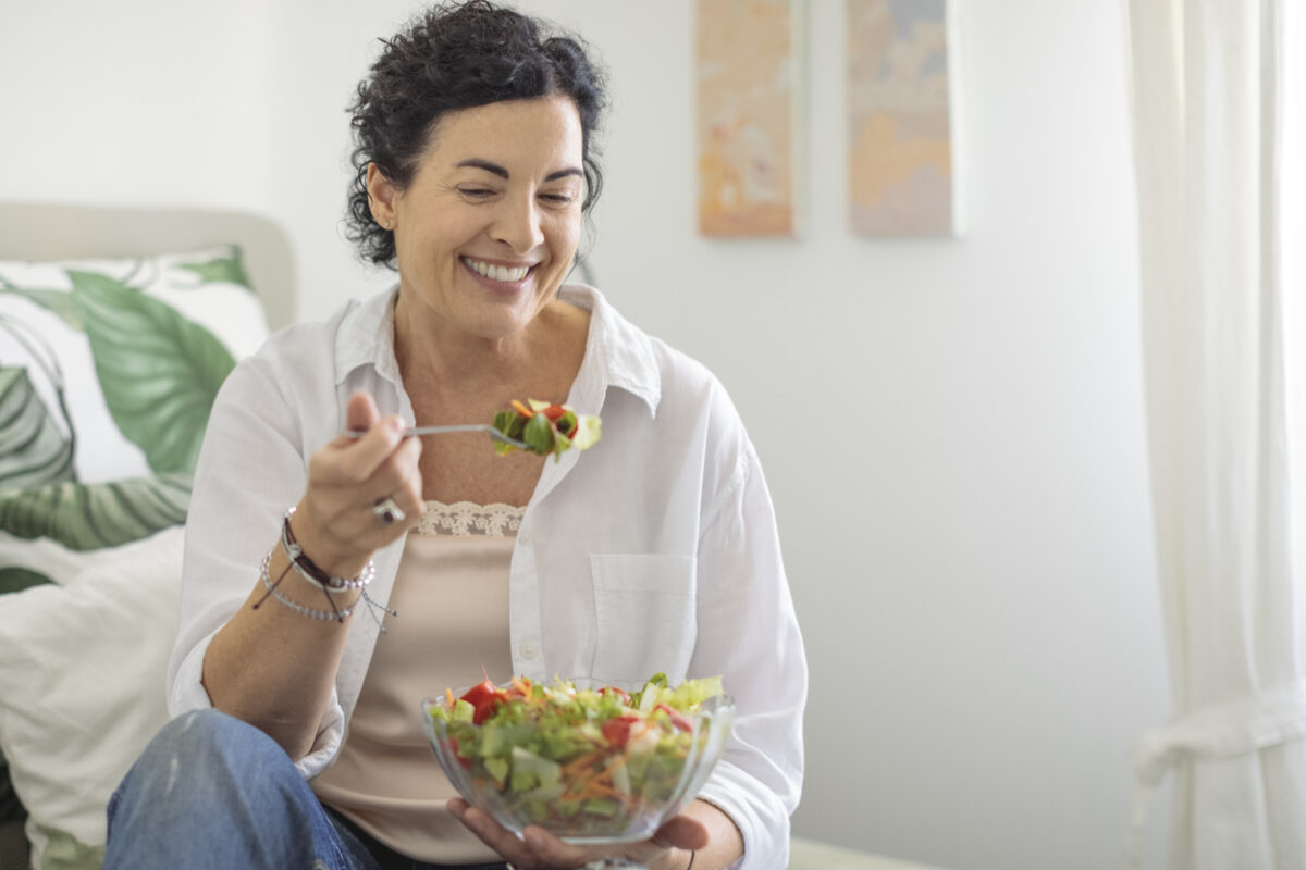 Woman eating a salad or a healthy meal