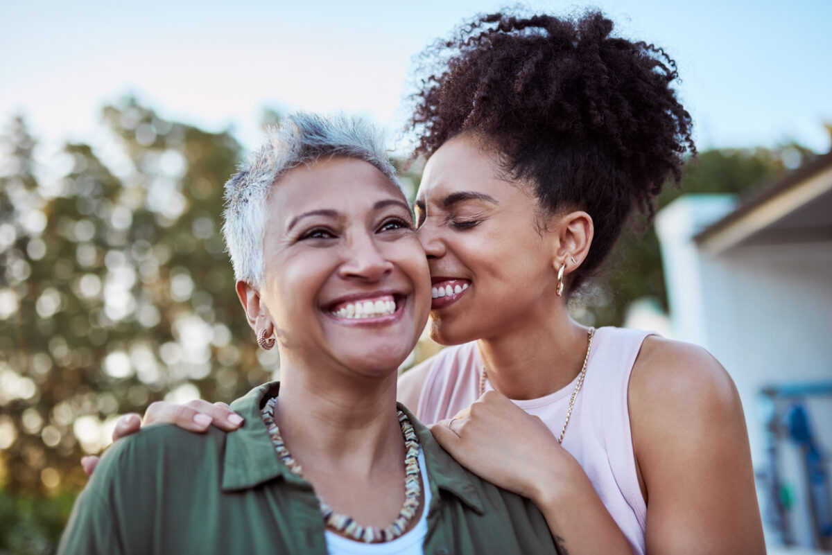 Mother and daughter hugging