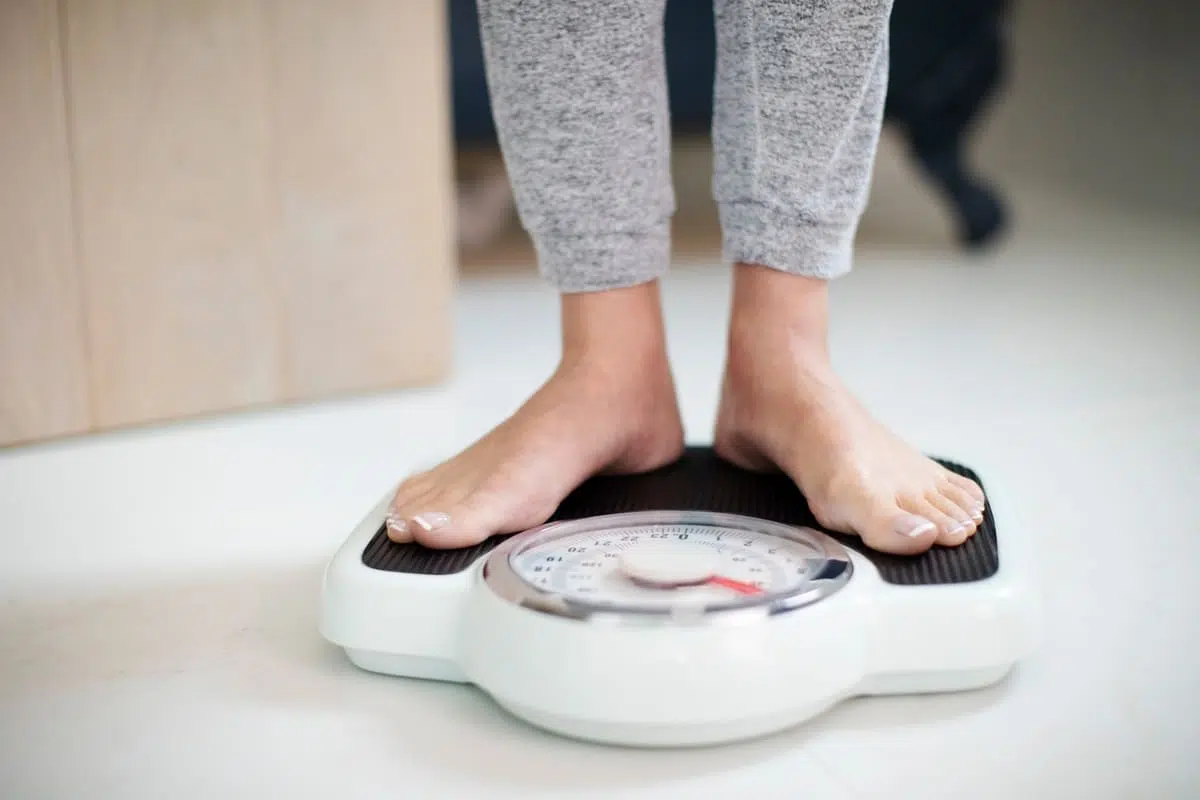 Woman standing on scale