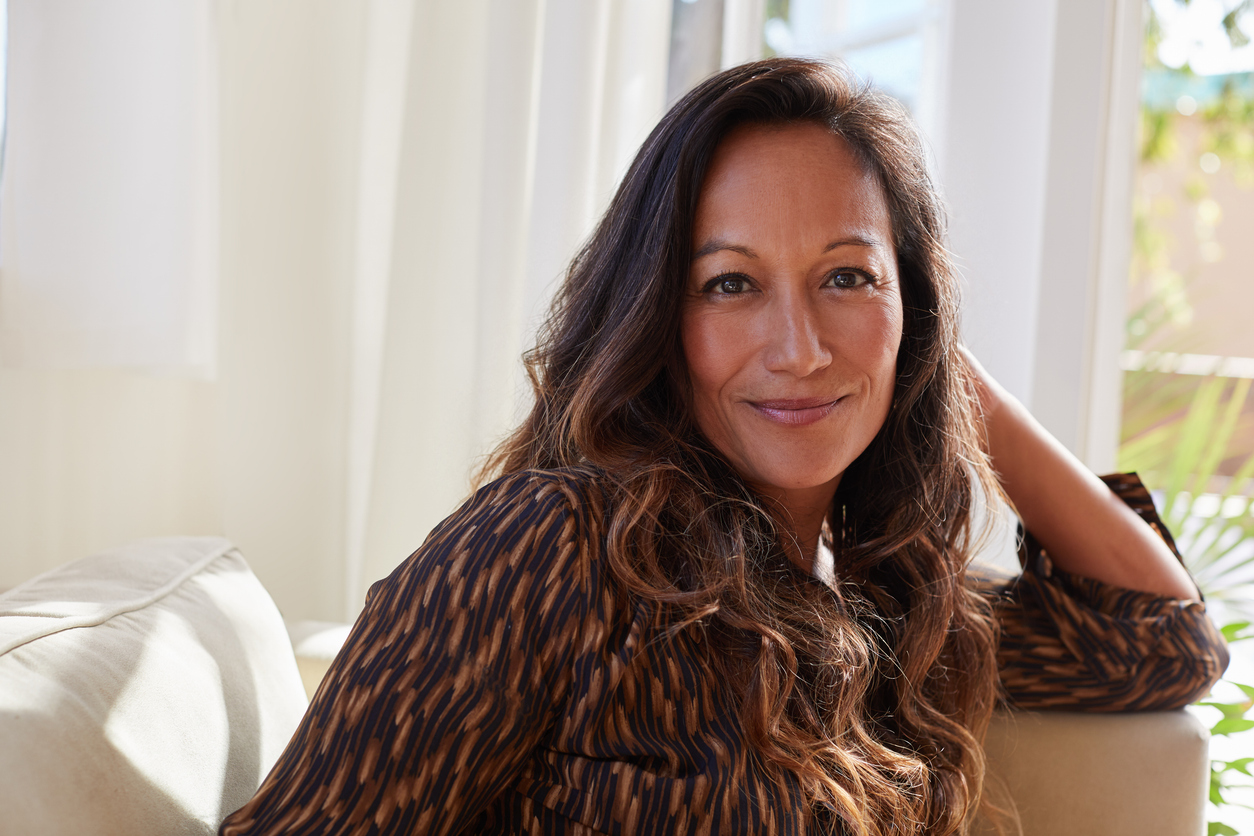 Secrets to age backwards, smiling woman, long hair