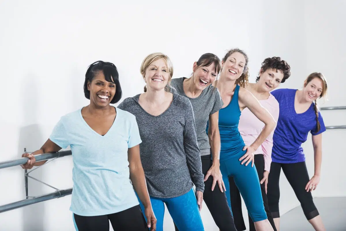 women taking a barre class