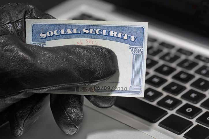 Thief and Social Security Card. Common Scams: Social Security Scams
