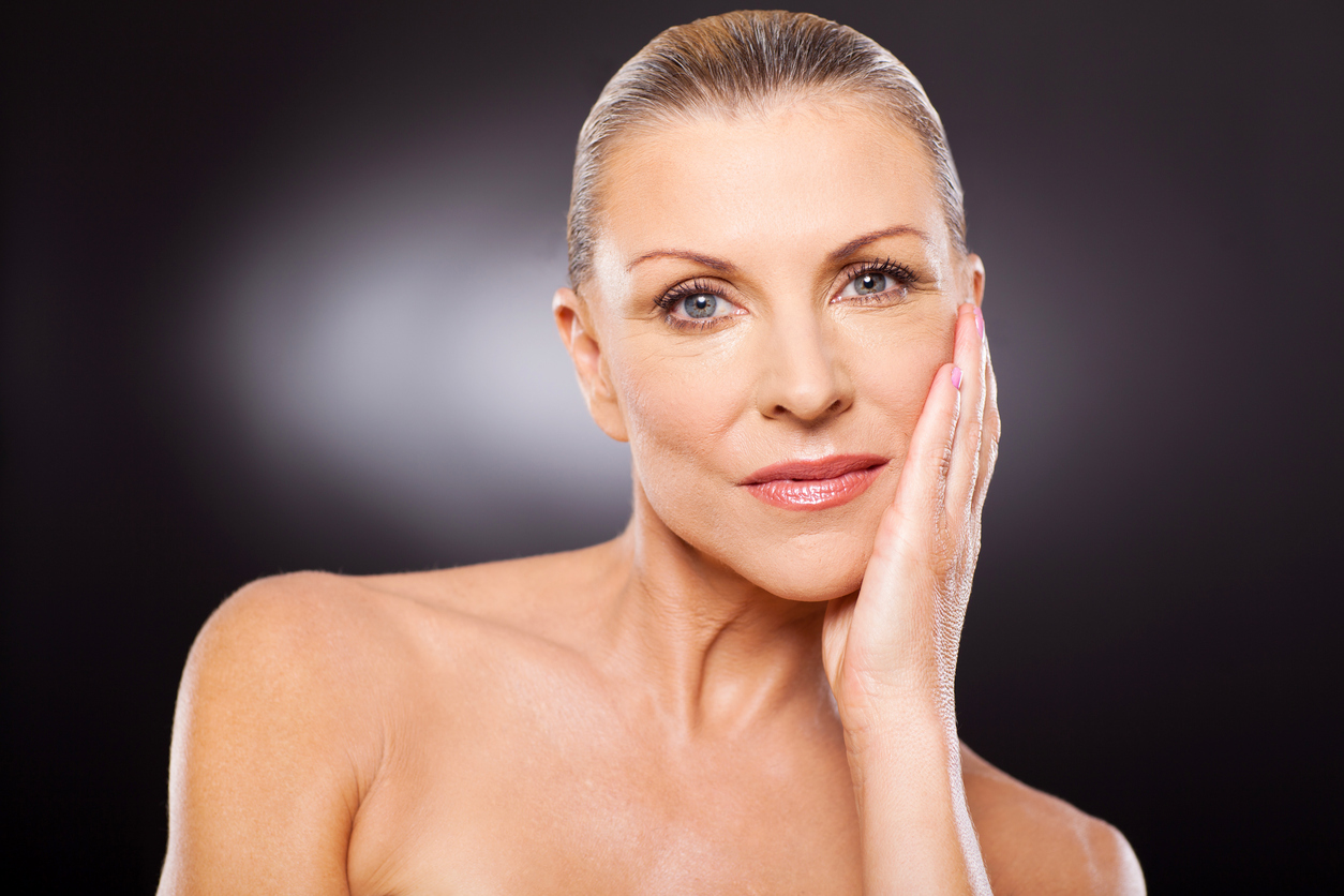 The relationship between diet and aging; long hair, woman looking in mirror