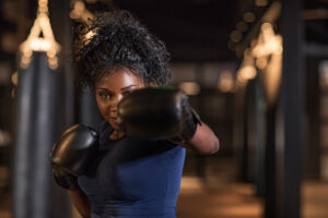 Female boxer, slugging it out over dry skin care feature