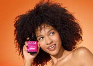 Hum Hair Strong woman with product