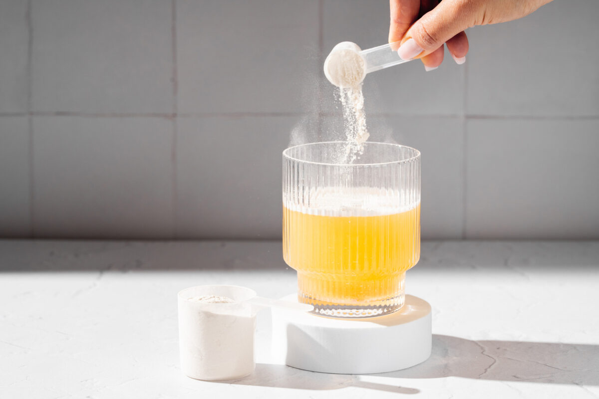 Collagen protein powder in a scoop