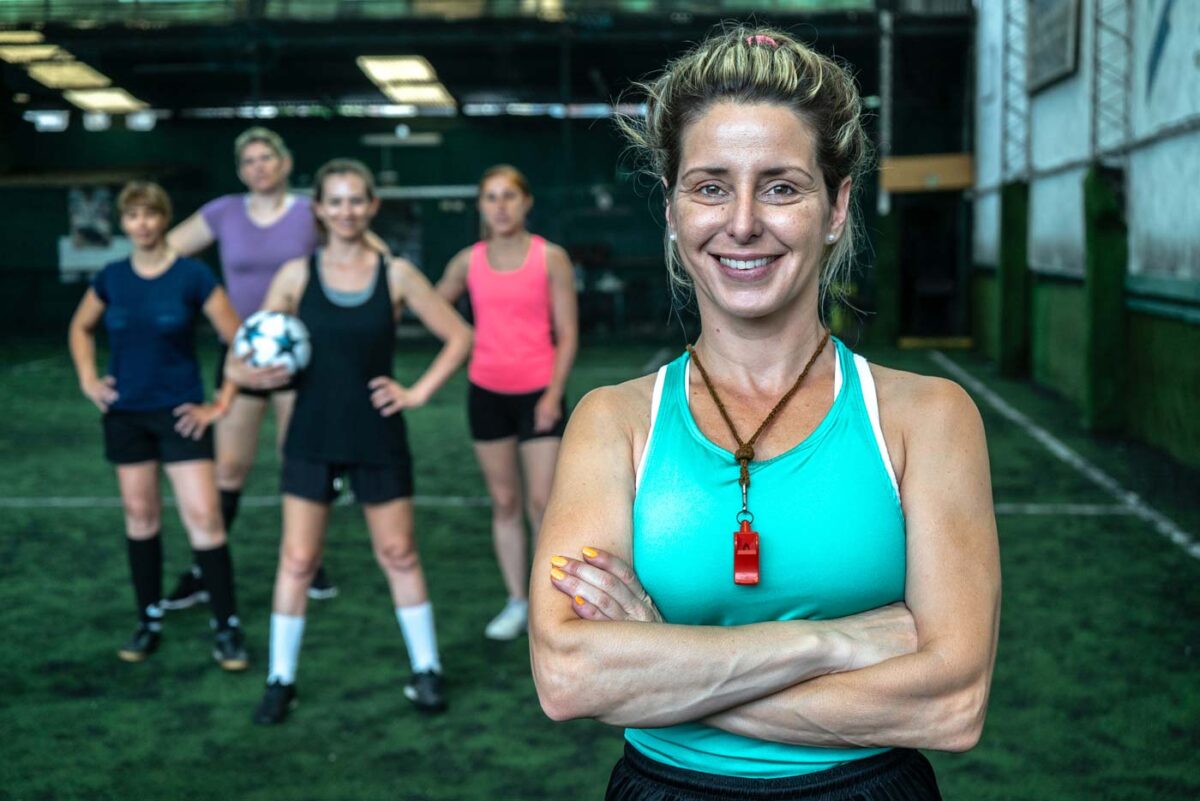 woman-soccer-coach-with-kids