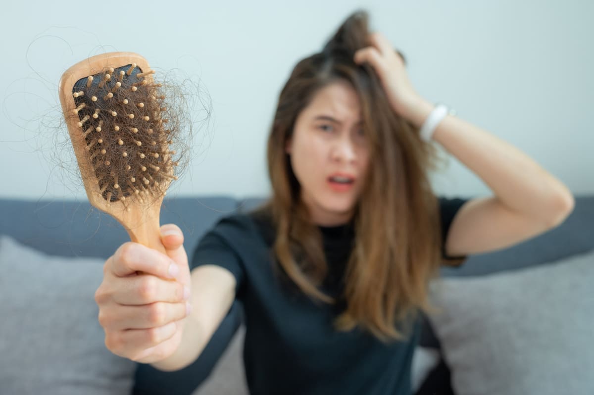 Foods that Fight Hair Loss; woman with thinning hair