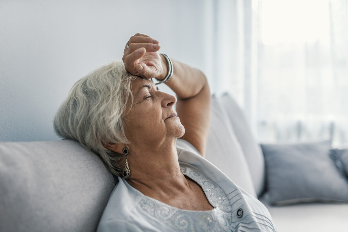 Slow Gate and Dementia --  Thoughtful senior woman relaxing on bed.