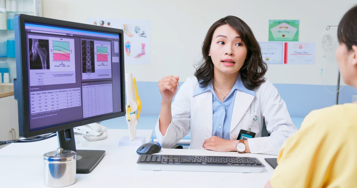 Bone density feature; woman talking with her doctor