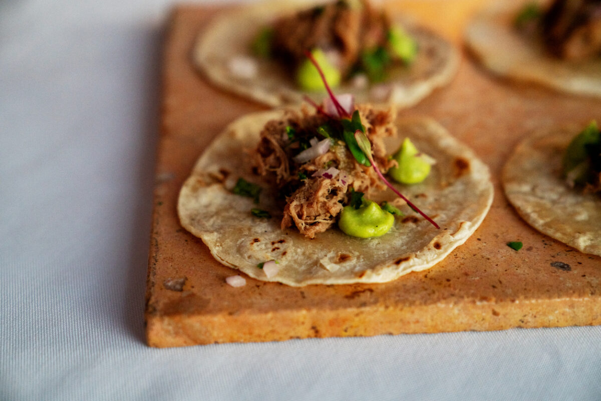 Beautifully Styled Shredded Beef Tacos On Corn Tortillas With Dots Of Guacamole