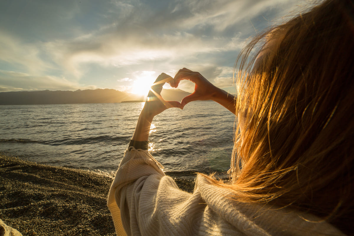woman making a heart sign
