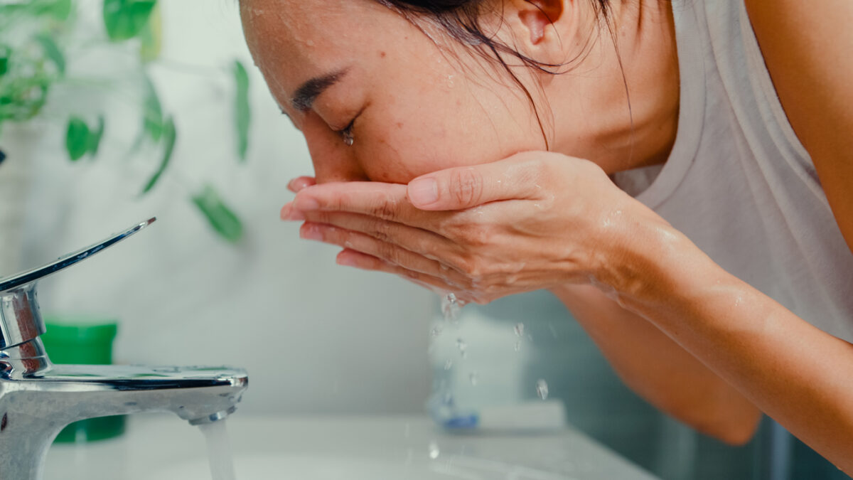 woman washing face