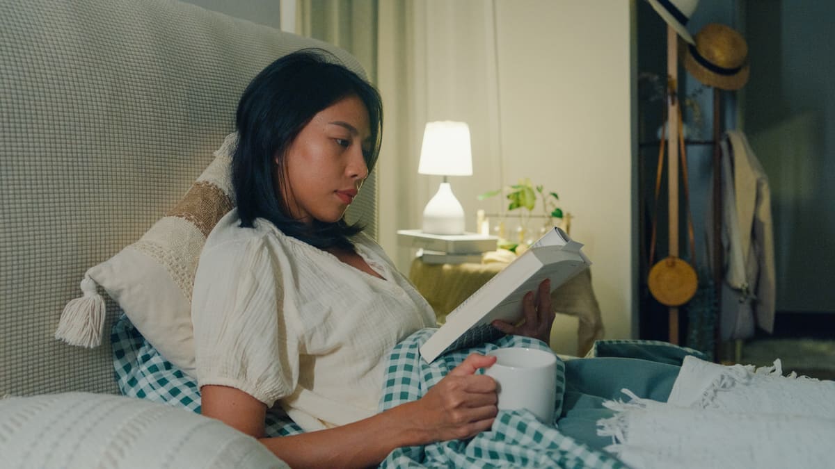 Woman reading in bed