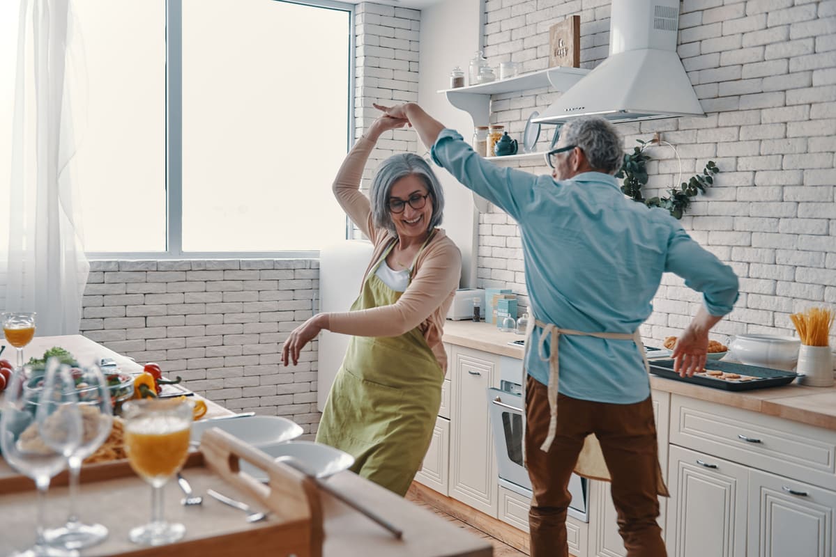 couple dancing in kitchen
