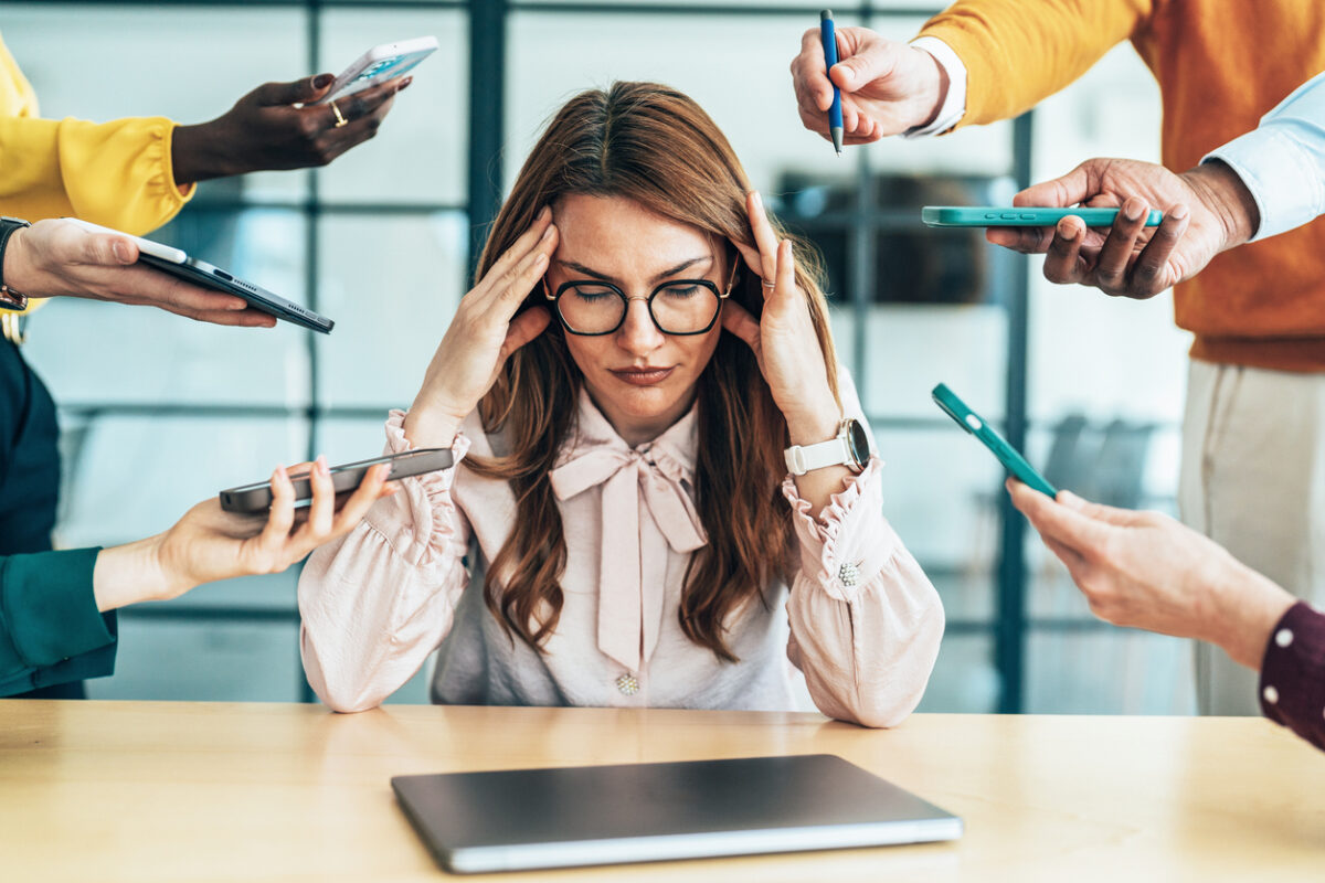 Stressed or overwhelmed woman in an office setting