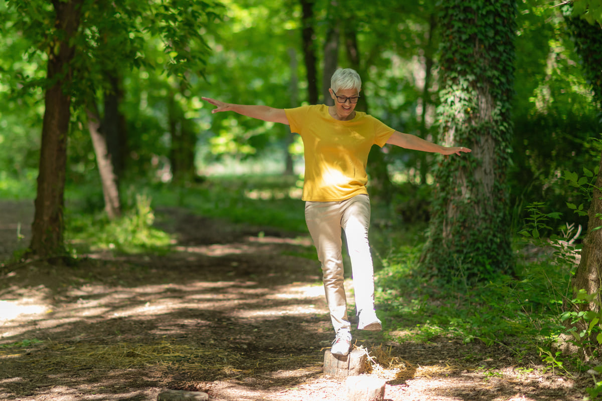 Woman balancing on a tree