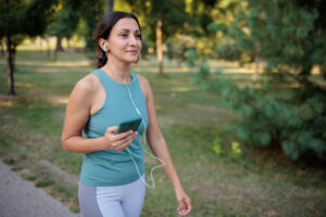 Woman listening to music while walking