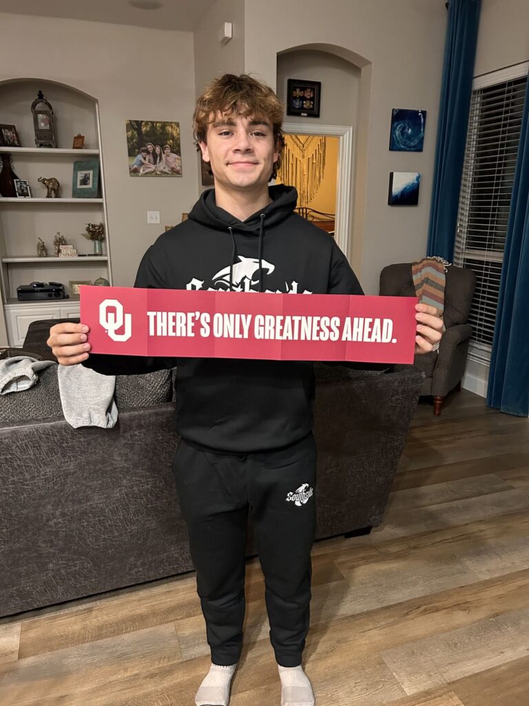 Jonah holding OU Banner